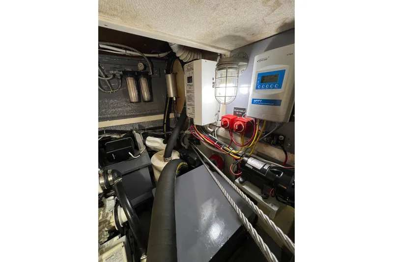 Slide: The Image of Engine room of a 1978 Gulfstar Ketch with electrical components and wiring. - 47