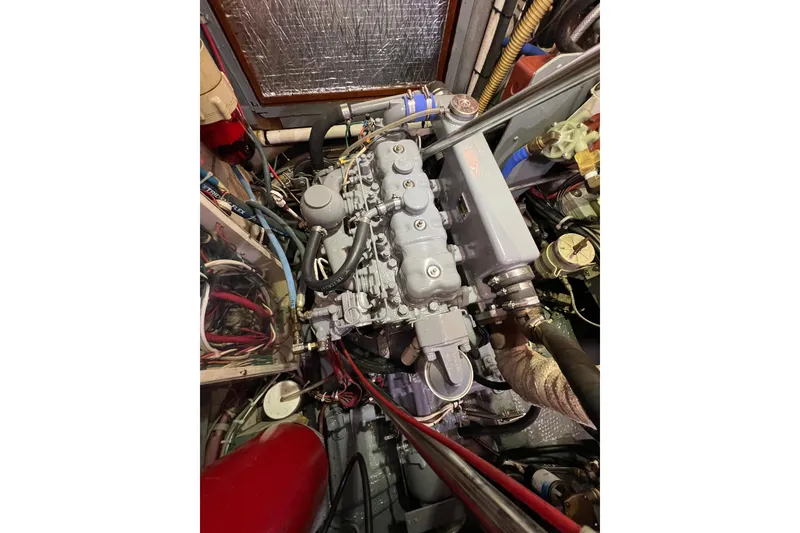 Slide: The Image of Engine compartment of a 1978 Gulfstar Ketch sailboat, showcasing detailed mechanical components. - 50