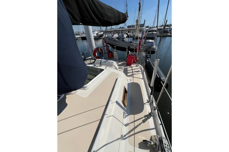Slide: The Image of 1978 Gulfstar Ketch sailboat docked at marina, showcasing deck and rigging. - 6