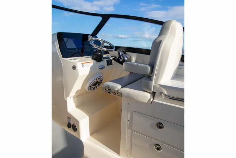 Slide: The Image of Manufacturer Provided Image: 2025 Scout 277 Dorado boat cockpit with steering wheel and seating. - 8