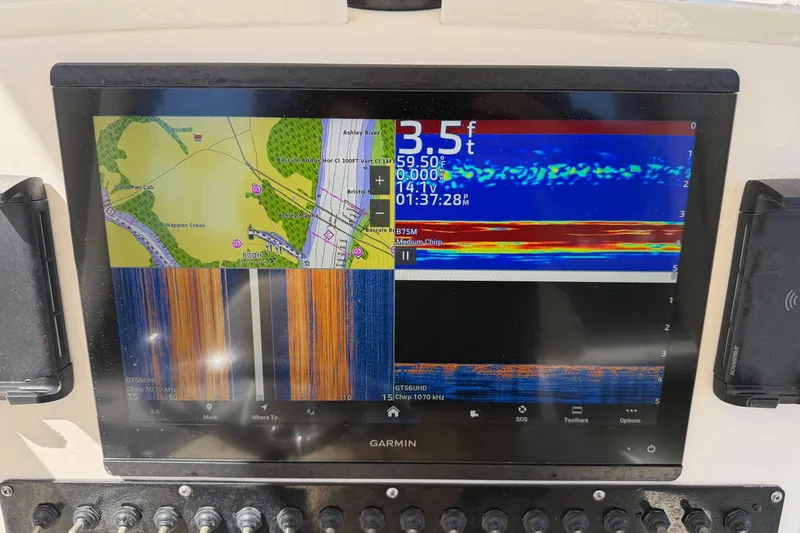 Slide: The Image of Garmin marine navigation display on 2022 Pathfinder 2200 TRS boat dashboard. - 35