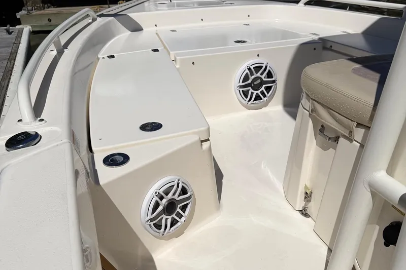 Slide: The Image of 2022 Pathfinder 2200 TRS boat interior with speakers and seating. - 37