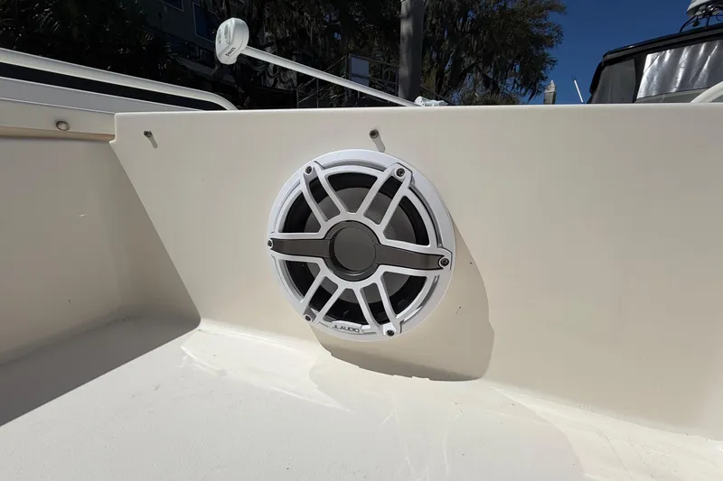 Slide: The Image of JL Audio speaker on 2022 Pathfinder 2200 TRS boat, mounted on white panel. - 38
