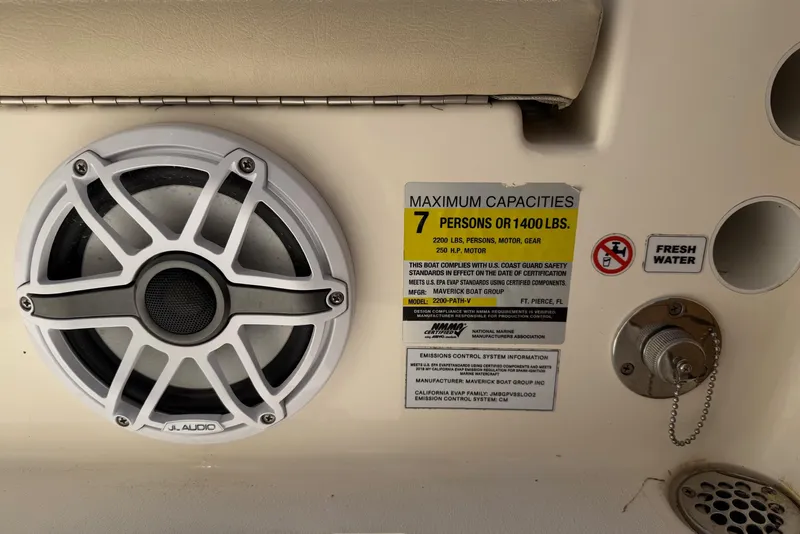 Slide: The Image of Speaker and capacity label on 2022 Pathfinder 2200 TRS boat interior. - 39
