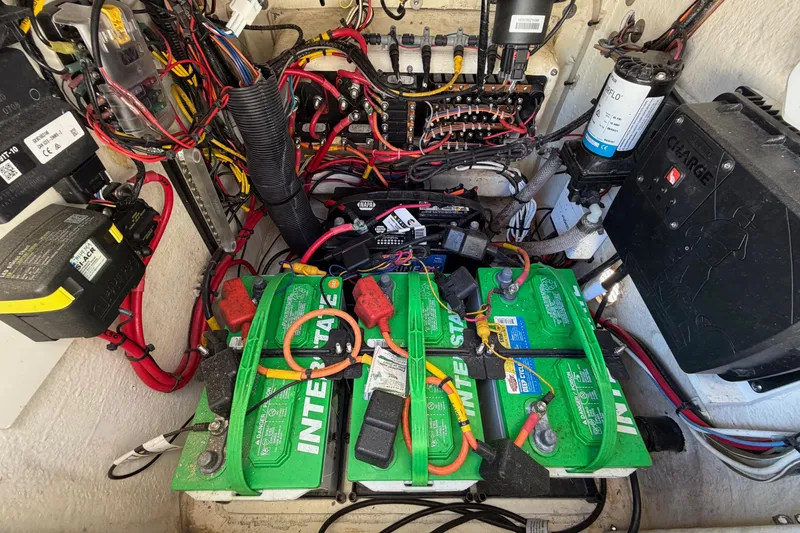 Slide: The Image of Electrical system of a 2022 Pathfinder 2200 TRS boat with batteries and wiring. - 46