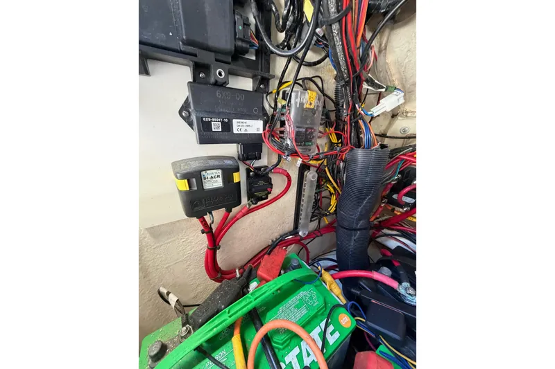 Slide: The Image of Electrical wiring and components inside a 2022 Pathfinder 2200 TRS boat. - 48