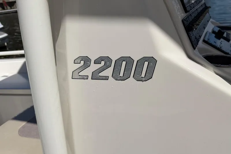 Slide: The Image of Close-up of 2022 Pathfinder 2200 TRS boat model number on white surface. - 50
