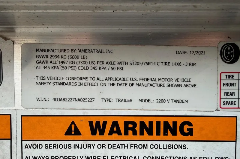 Slide: The Image of Label on 2022 Pathfinder 2200 TRS trailer detailing specifications and safety warnings. - 54