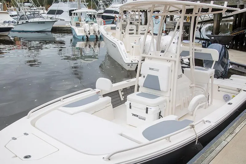Slide: The Image of Manufacturer Provided Image: 2022 Pathfinder 2200 TRS boat docked at a marina with other boats. - 59