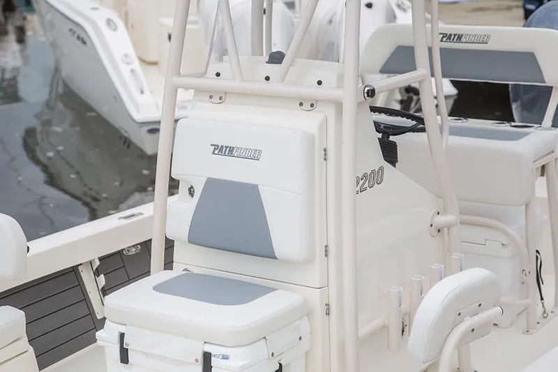 Slide: The Image of Manufacturer Provided Image: 2022 Pathfinder 2200 TRS boat interior with cushioned seating and storage. - 60