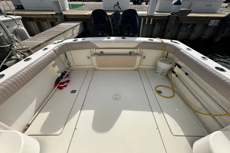 Slide: The Image of 2001 Scout 280 Abaco boat deck with seating, docked at marina. - 13