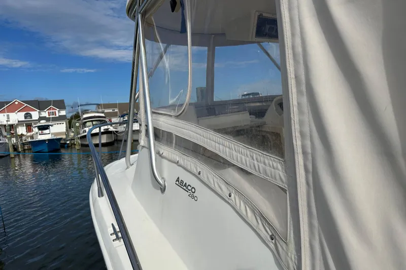 Slide: The Image of 2001 Scout 280 Abaco boat docked at marina with clear skies. - 15