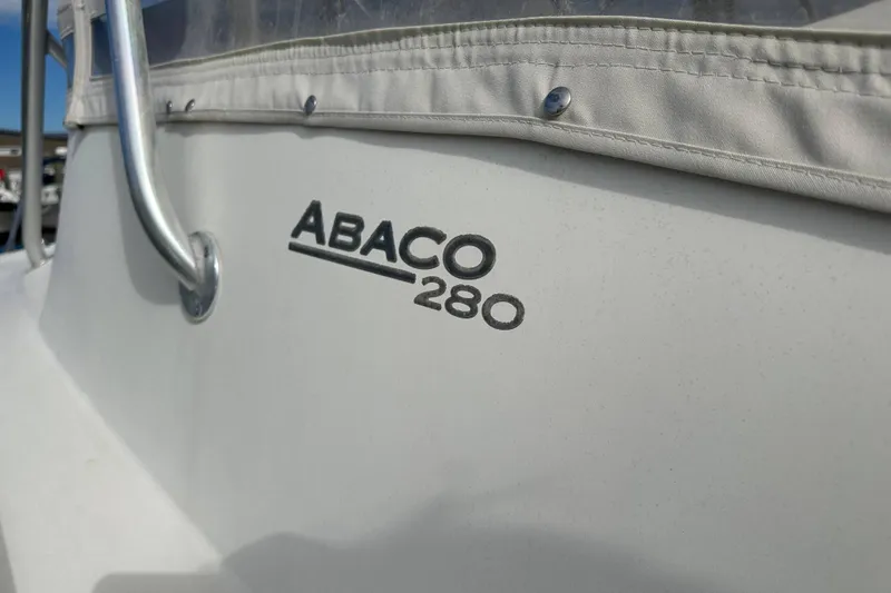 Slide: The Image of Close-up of 2001 Scout 280 Abaco boat logo and railing. - 16