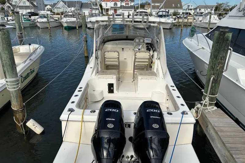 Slide: The Image of Scout 280 Abaco 2001 boat docked with twin 200 horsepower engines. - 19