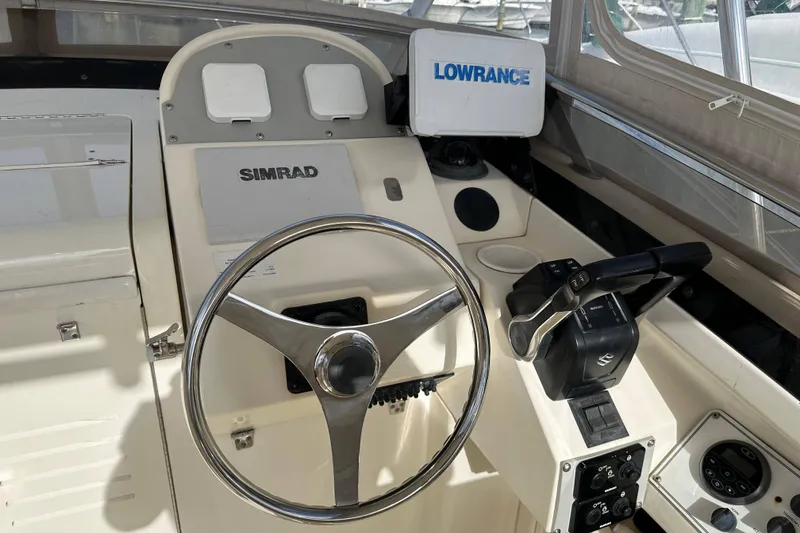 Slide: The Image of Helm of 2001 Scout 280 Abaco boat with Simrad and Lowrance equipment. - 5