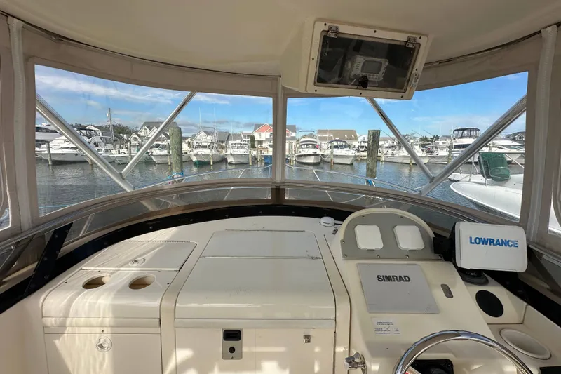 Slide: The Image of Interior view of 2001 Scout 280 Abaco boat with marina in background. - 7
