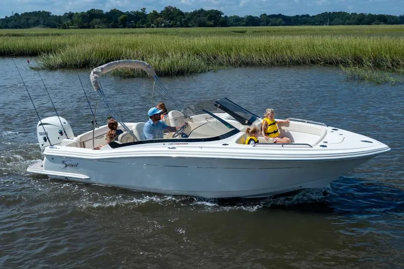 Slide: The Image of Manufacturer Provided Image: 2026 Scout 220 Dorado boat cruising on a scenic river with passengers enjoying the ride. - 1