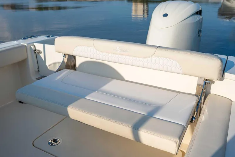 Slide: The Image of Manufacturer Provided Image: 2026 Scout 220 Dorado boat seat with elegant white upholstery and sleek design. - 10