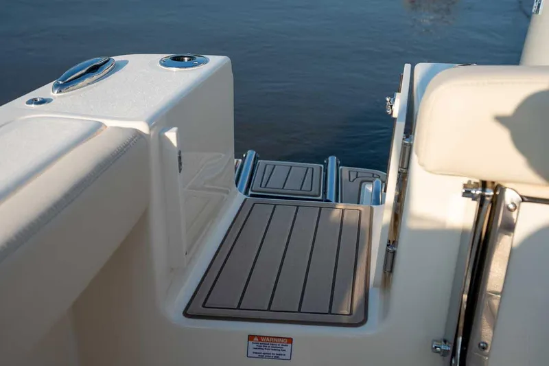 Slide: The Image of Manufacturer Provided Image: 2026 Scout 220 Dorado boat deck with seating and water view. - 11