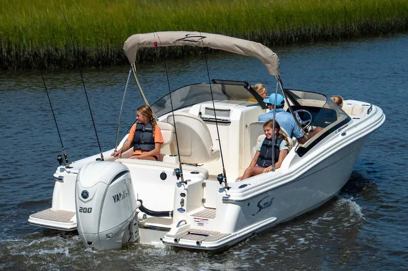 Slide: The Image of Manufacturer Provided Image: 2026 Scout 220 Dorado boat cruising on water with passengers enjoying the ride. - 3
