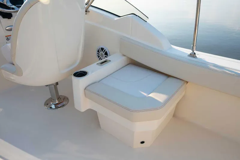 Slide: The Image of Manufacturer Provided Image: 2026 Scout 220 Dorado boat interior with white seating and cup holder. - 9