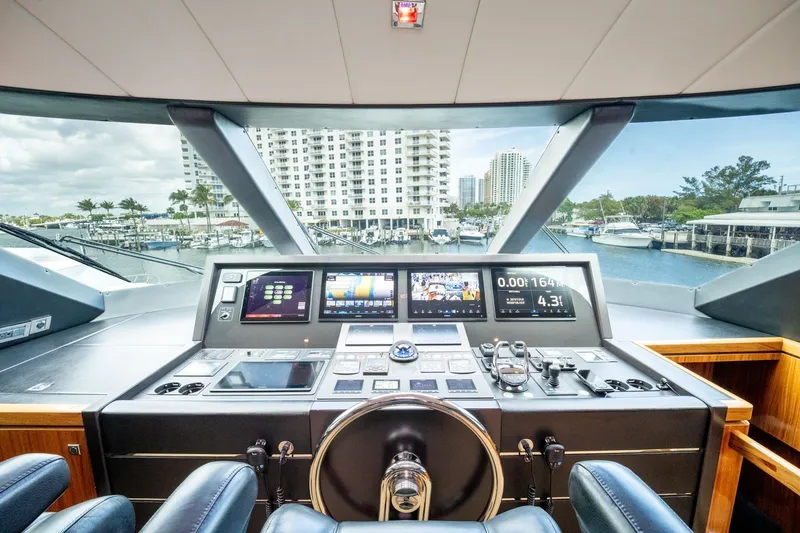 Slide: The Image of Horizon E88 yacht helm, 2013 model, featuring modern navigation electronics. - 18