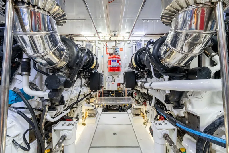 Slide: The Image of Engine room of 2013 Horizon E88 yacht with shiny exhaust pipes. - 28