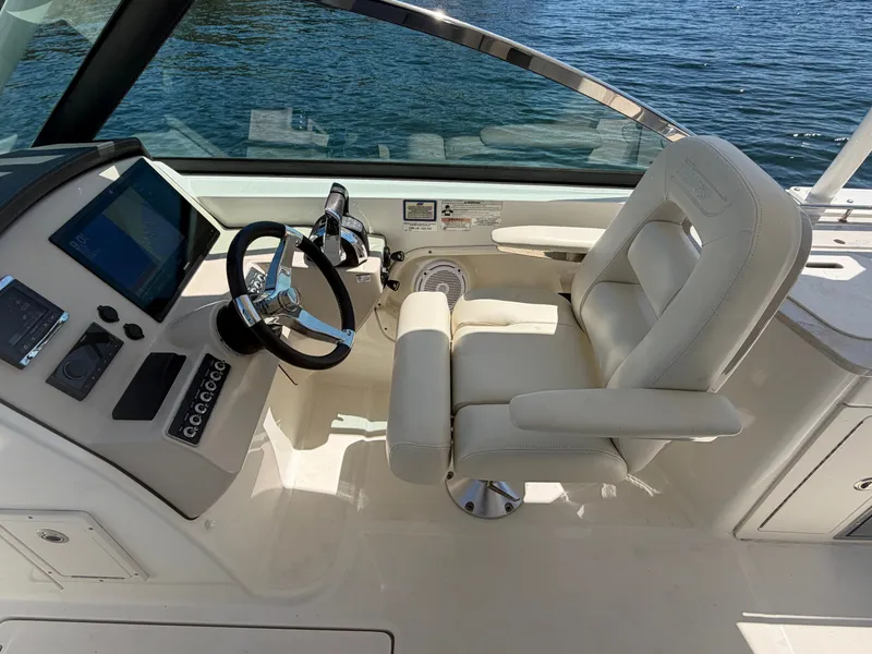 Slide: The Image of Interior of 2016 Boston Whaler 270 Vantage with helm console. - 11