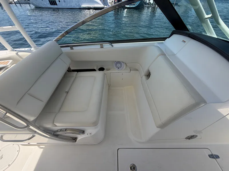 Slide: The Image of Interior of a 2016 Boston Whaler 270 Vantage boat with white seating. - 16