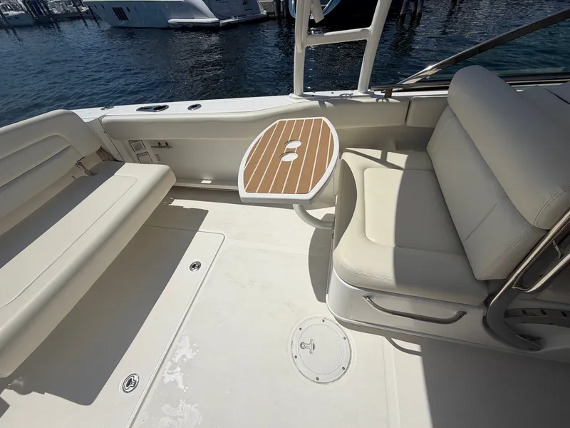 Slide: The Image of Interior of a 2016 Boston Whaler 270 Vantage with seating and table. - 20