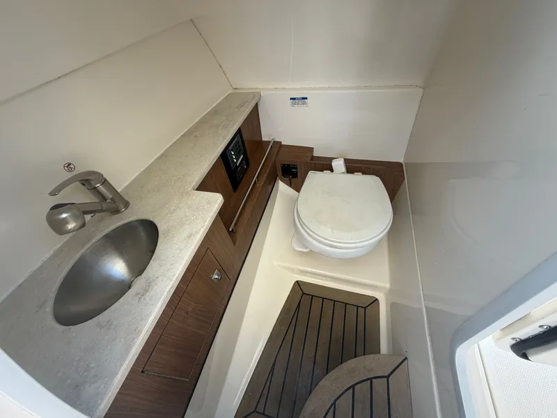 Slide: The Image of Interior of 2016 Boston Whaler 270 Vantage with sink and toilet. - 27