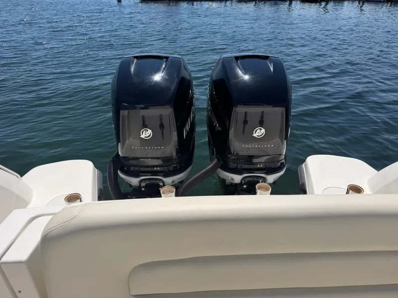 Slide: The Image of Two outboard motors on a 2016 Boston Whaler 270 Vantage boat. - 28