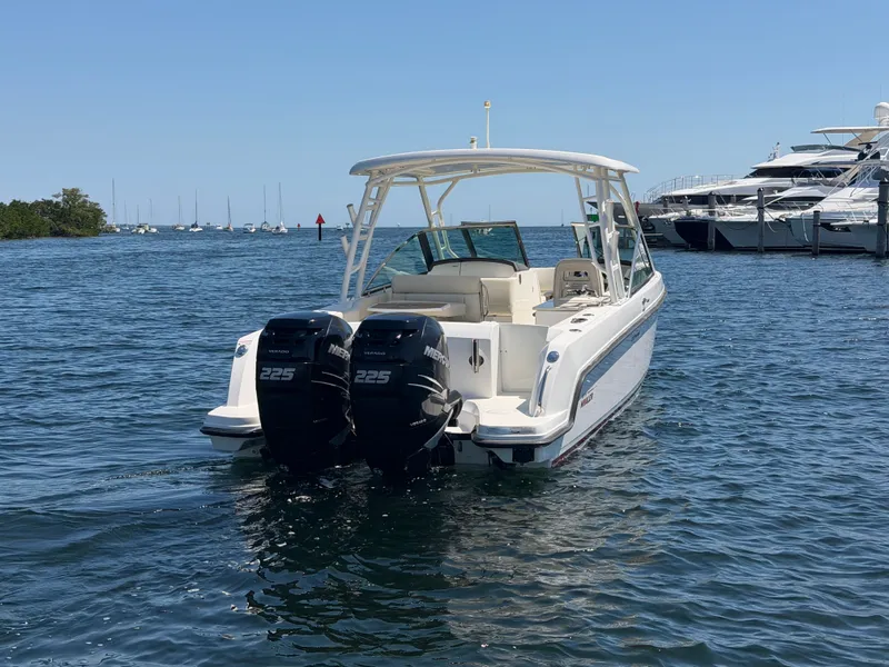 Slide: The Image of 2016 Boston Whaler 270 Vantage boat on water with twin engines. - 4