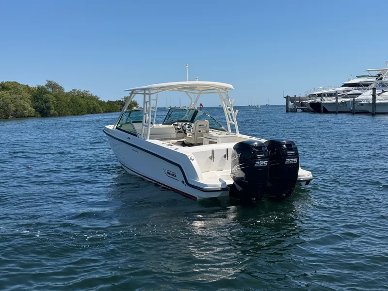 Slide: The Image of 2016 Boston Whaler 270 Vantage on open water with twin outboard engines. - 6
