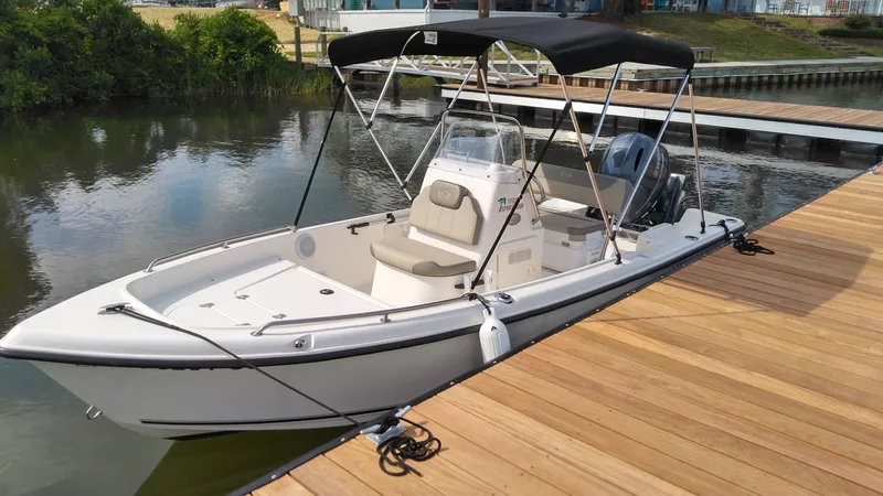 Slide: The Image of 2022 Key West 1720 boat docked at a pier. - 6