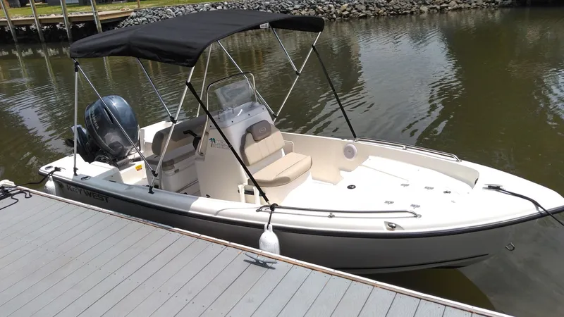 Slide: The Image of 2022 Key West 1720 boat docked with black canopy. - 7