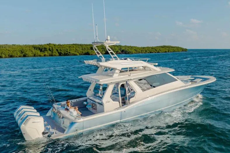 Slide: The Image of Manufacturer Provided Image: 2025 Scout 530 LXF luxury yacht cruising on open water. - 1