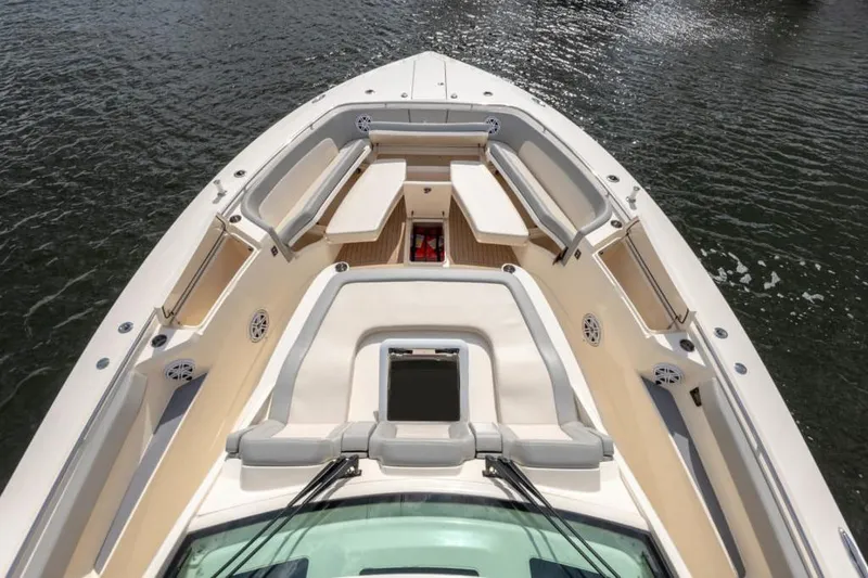 Slide: The Image of Manufacturer Provided Image: 2025 Scout 530 LXF boat deck with luxurious seating and open water view. - 10