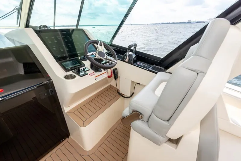 Slide: The Image of Manufacturer Provided Image: 2025 Scout 530 LXF helm with modern controls and ocean view. - 16