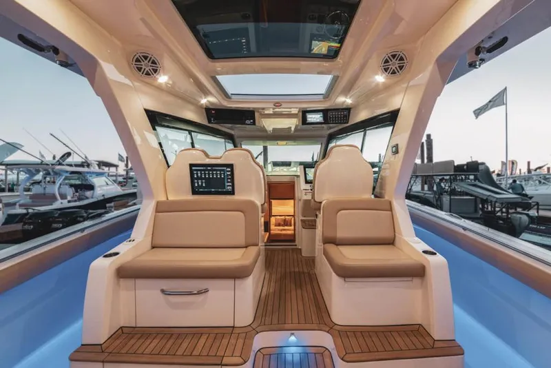 Slide: The Image of Manufacturer Provided Image: Luxurious interior of 2025 Scout 530 LXF yacht with plush seating and advanced controls. - 18
