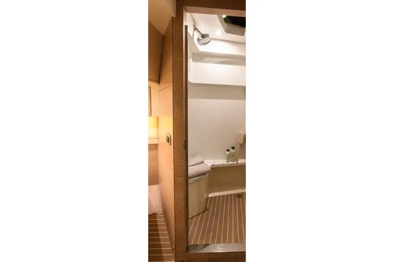 Slide: The Image of Manufacturer Provided Image: Interior of 2025 Scout 530 LXF yacht bathroom with modern design and wooden accents. - 26