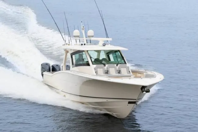 Slide: The Image of Manufacturer Provided Image: 2025 Scout 530 LXF luxury boat cruising on open water. - 4