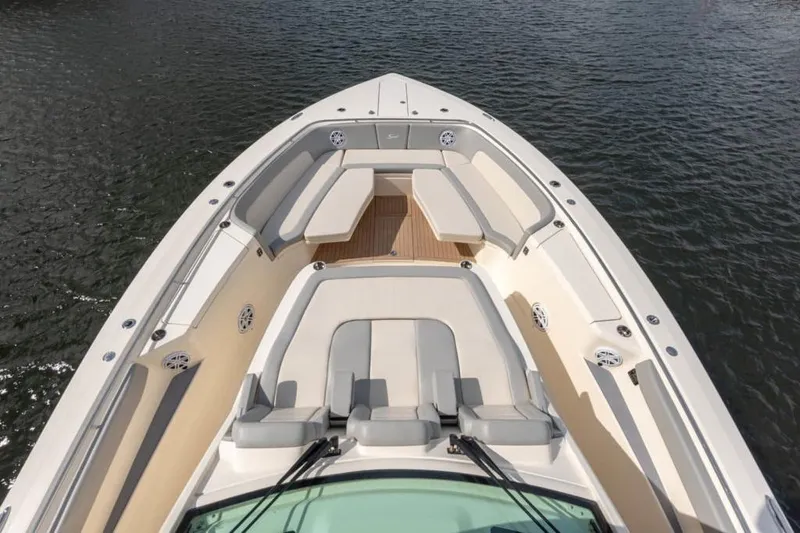 Slide: The Image of Manufacturer Provided Image: 2025 Scout 530 LXF boat deck with luxurious seating on water. - 9