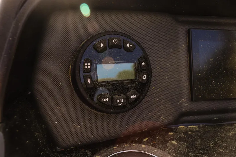 Slide: The Image of Control panel of 2024 Yamaha Boats AR195 with Bluetooth and media buttons. - 16