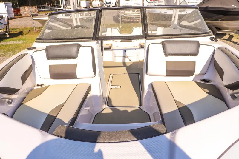 Slide: The Image of 2024 Yamaha Boats AR195 interior with cushioned seating and windshield. - 9