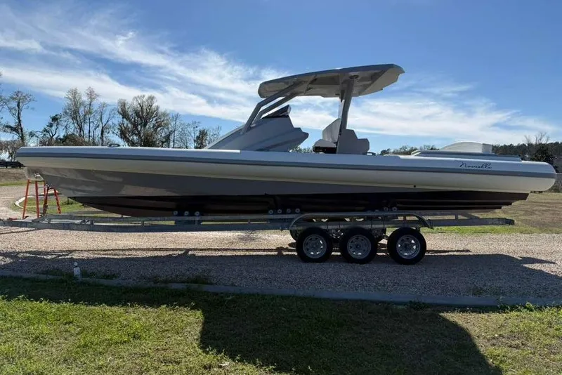 Slide: The Image of 2026 Novielli Veloche 349 boat on trailer under clear sky. - 1