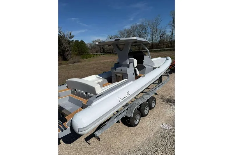 Slide: The Image of 2026 Novielli Veloche 349 boat on trailer, sleek design, outdoor setting. - 13