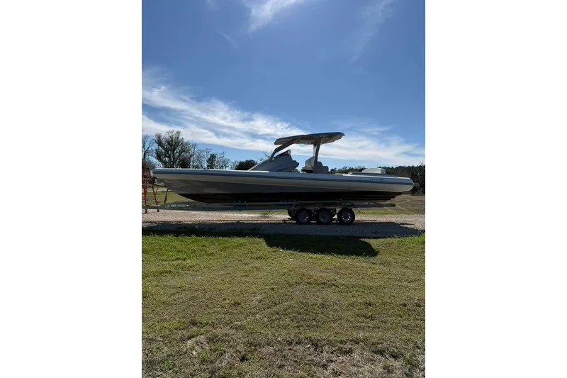 Slide: The Image of 2026 Novielli Veloche 349 boat on trailer under clear blue sky. - 3