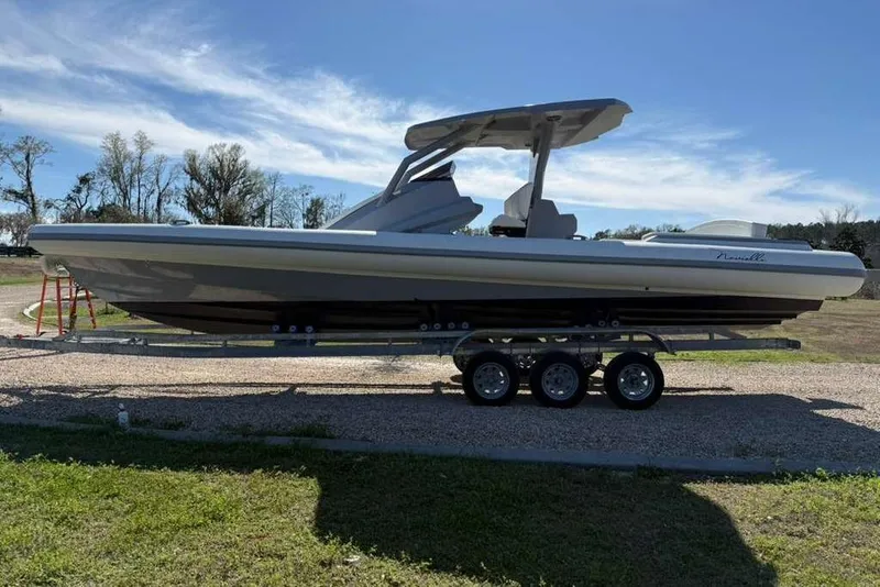 Slide: The Image of 2026 Novielli Veloche 349 boat on trailer, parked outdoors under clear sky. - 6