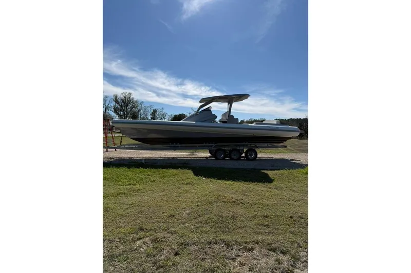 Slide: The Image of 2026 Novielli Veloche 349 boat on trailer under clear blue sky. - 7